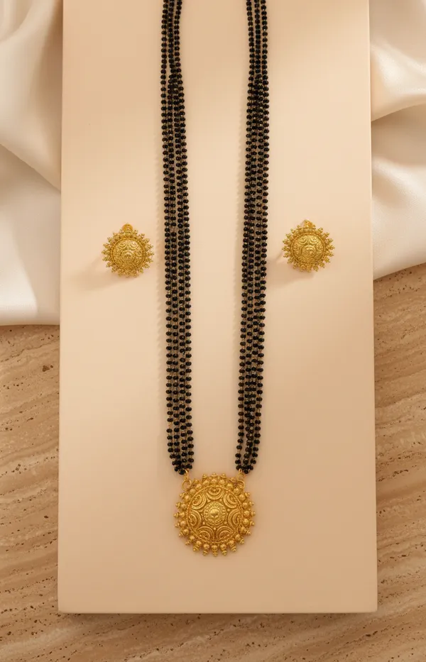 Exquisite_Triple-Strand_Gold-Plated_Mangalsutra_Set_with_Sunburst_Filigree_Pendant_and_Matching_Studs
