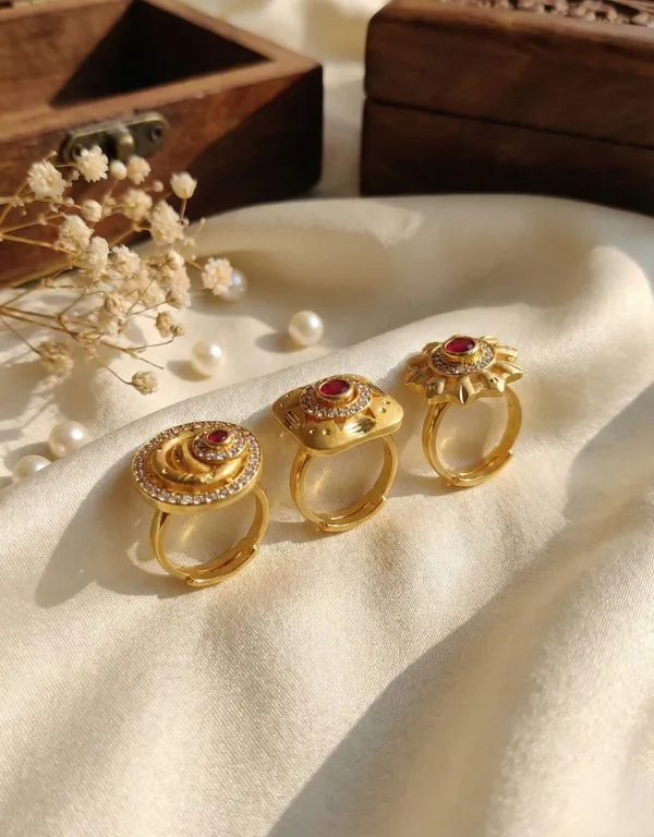 A_Set_of_Three_Ruby-Inlaid_Gold_Statement_Pieces