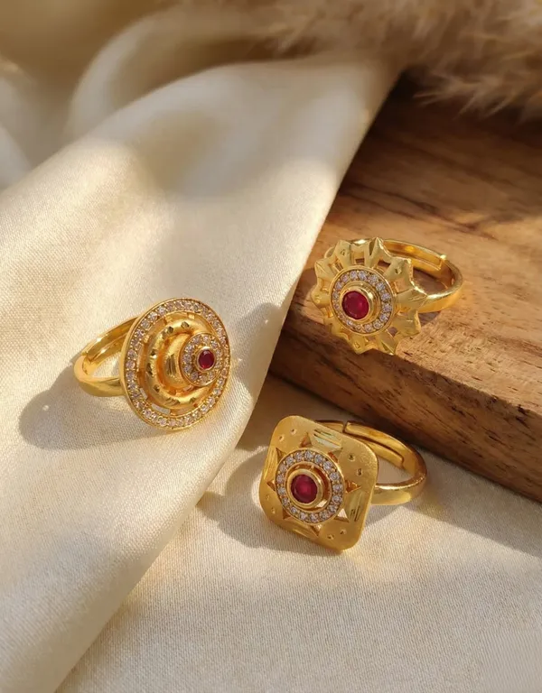 A_Set_of_Three_Ruby-Inlaid_Gold_Statement_Pieces