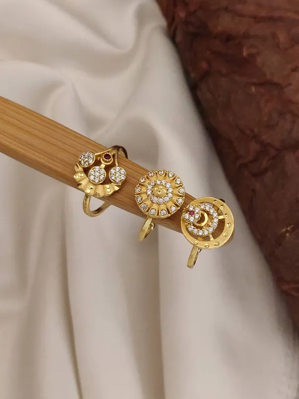 Assorted_Gold-Toned_Rings:_A_Collection_of_Circular_Designs