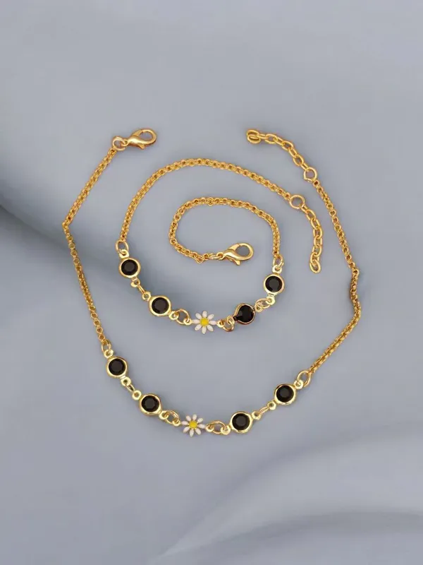Delicate_Gold_Anklet_with_Black_Gemstones_and_Daisy_Charm