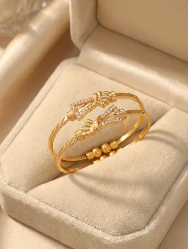 Elegant_Gold_Bangle_Pair_with_Floral_Accents_and_Cubic_Zirconia