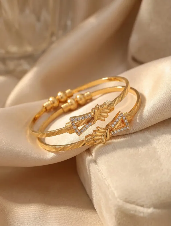 Elegant_Gold_Bangle_Pair_with_Floral_Accents_and_Cubic_Zirconia