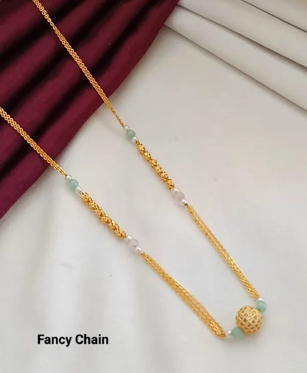 Elegant_Gold_Fancy_Chain_with_Interspersed_Gemstones_and_Textured_Gold_Sphere_Accent