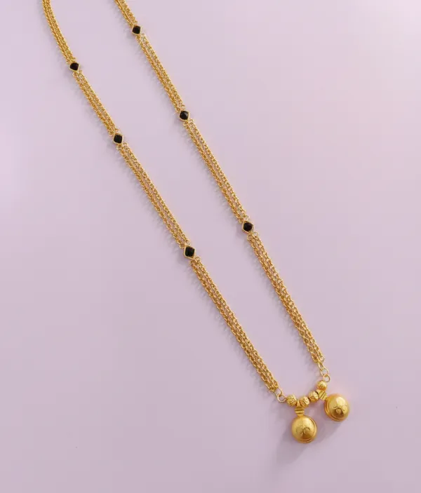 Elegant_Triple-Strand_Gold-Plated_Necklace_with_Black_Onyx_Accents_&_Textured_Bell_Charms
