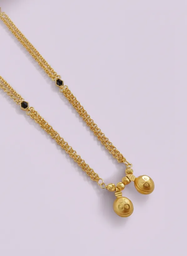 Elegant_Triple-Strand_Gold-Plated_Necklace_with_Black_Onyx_Accents_&_Textured_Bell_Charms