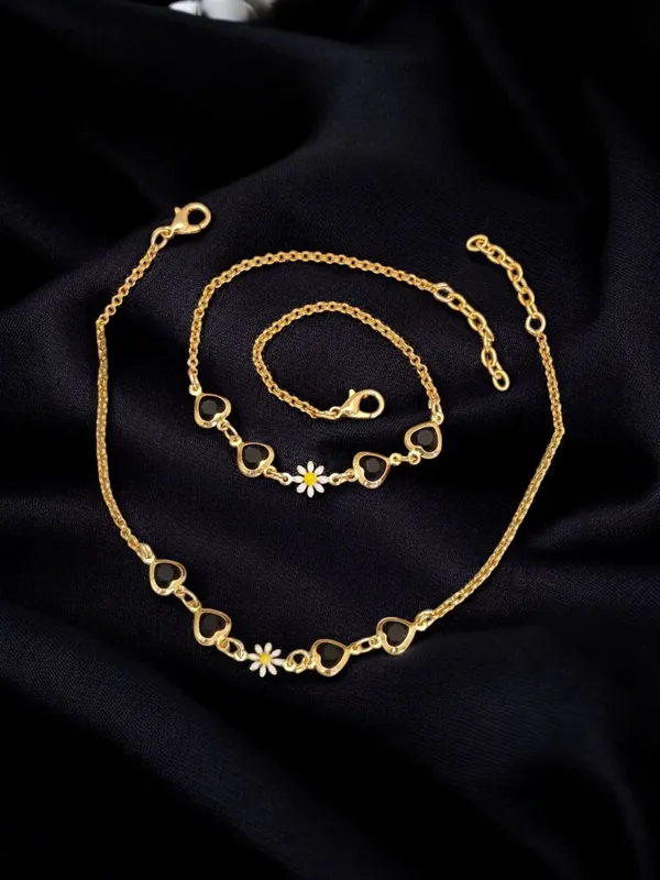 Enchanting_Gold_Anklet_with_Black_Heart_Charms_and_Daisy_Accent