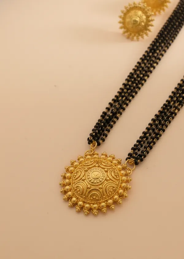 Exquisite_Triple-Strand_Gold-Plated_Mangalsutra_Set_with_Sunburst_Filigree_Pendant_and_Matching_Studs