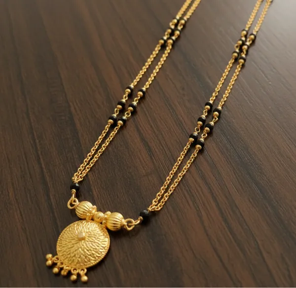 Gold-Plated_Double-Layered_Black_Bead_Mala_with_Filigree_Sunburst_Pendant