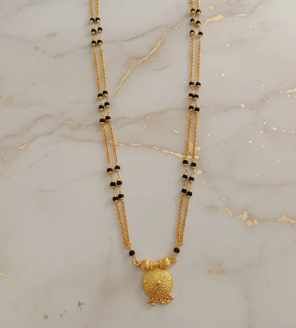 Gold-Plated_Double-Layered_Black_Bead_Mala_with_Filigree_Sunburst_Pendant