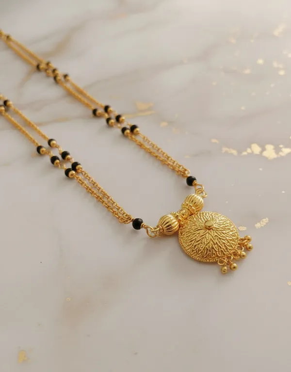 Gold-Plated_Double-Layered_Black_Bead_Mala_with_Filigree_Sunburst_Pendant