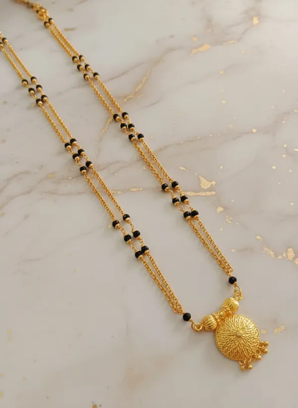 Gold-Plated_Double-Layered_Black_Bead_Mala_with_Filigree_Sunburst_Pendant