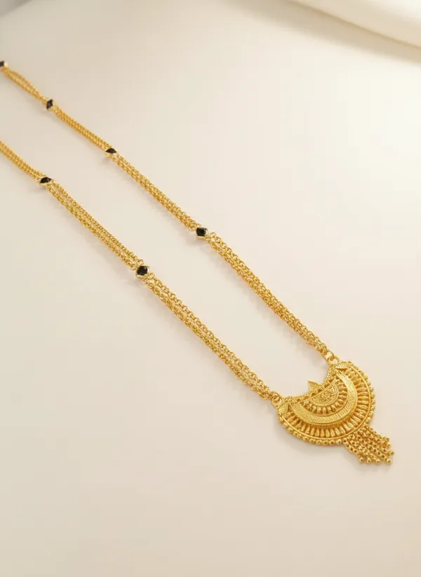 Gold-Plated_Long_Necklace_with_Traditional_Temple_Art_Pendant_and_Black_Bead_Accents