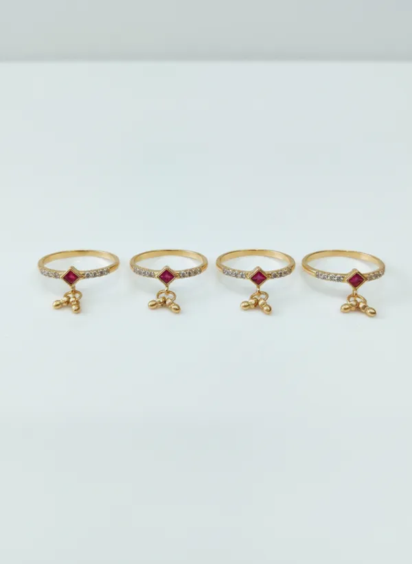 Gold_Rings_with_Ruby_Centerpiece_and_Dangling_Bead_Charms