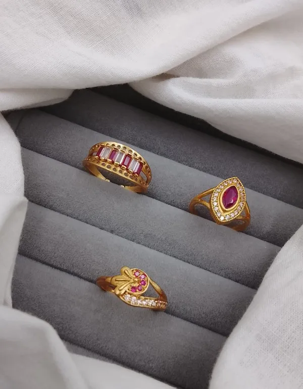 Intricate_Gold_Ring_Collection_with_Ruby_Accents