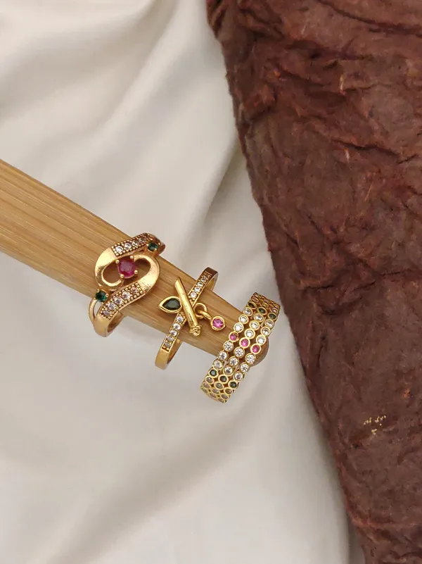Set_of_3_Elegant_Gold-Plated_Adjustable_Rings_with_Ruby_Solitaire,_Pave_Band,_and_Bypass_Designs