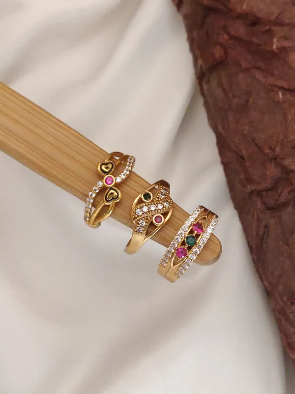 Set_of_3_Modern_Gold-Plated_Adjustable_Rings_with_Swirl,_Dangling_Cross,_and_Honeycomb_Bands