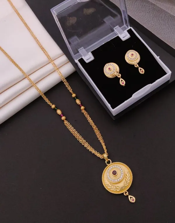 Striking_Circular_Motif_Gold_Plated_Mangalsutra_Set_with_Leaf_Detailing_&_Ruby_Drop_Earrings