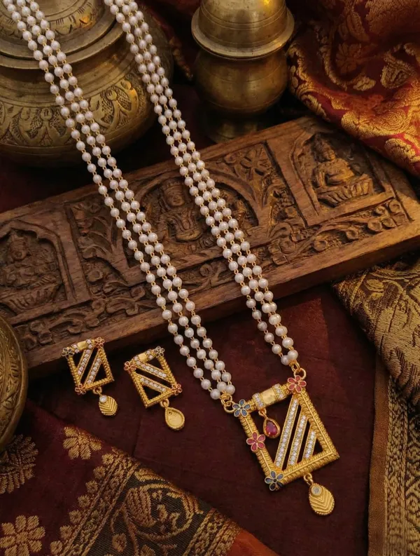 Three-Layered_Pearl_Mala_with_Geometric_Gold-Toned_Pendant_and_Matching_Earrings