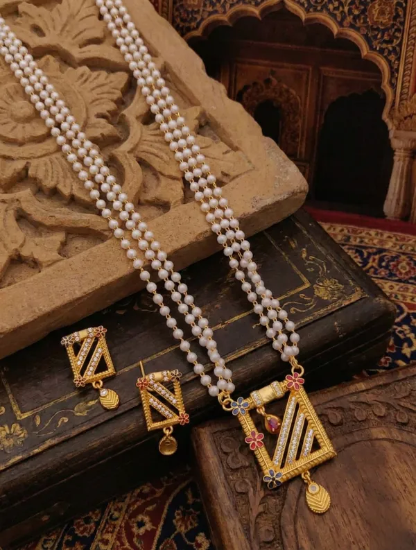 Three-Layered_Pearl_Mala_with_Geometric_Gold-Toned_Pendant_and_Matching_Earrings