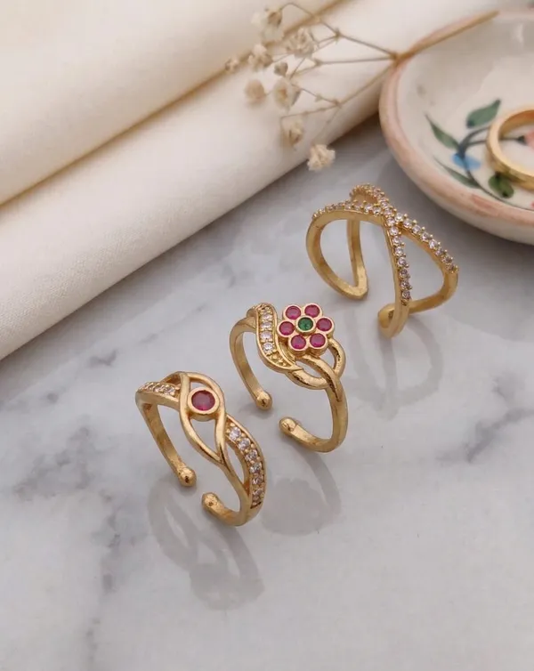 Three-Ring_Set:_This_set_includes_three_unique_gold-plated_rings.
