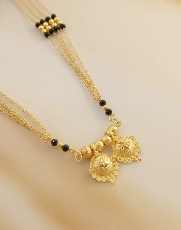 Timeless_Multi-Strand_Gold_Mangalsutra_with_Traditional_Wati_Pendant