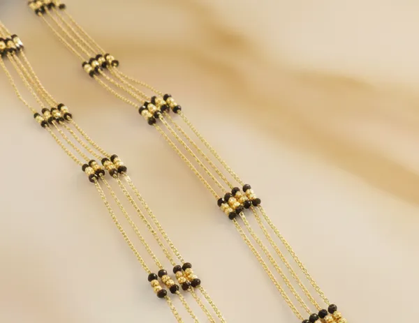 Timeless_Multi-Strand_Gold_Mangalsutra_with_Traditional_Wati_Pendant