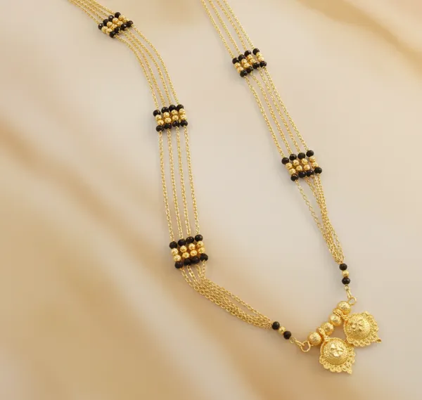 Timeless_Multi-Strand_Gold_Mangalsutra_with_Traditional_Wati_Pendant