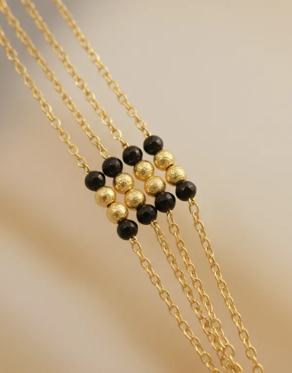 Timeless_Multi-Strand_Gold_Mangalsutra_with_Traditional_Wati_Pendant