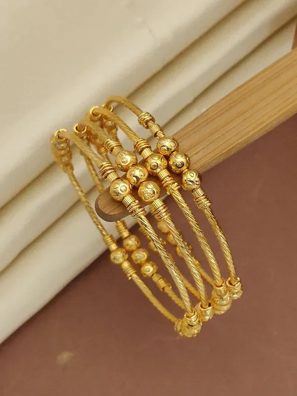 Traditional_Gold-Plated_Twisted_Wire_Bangles_with_Textured_Beads_(Set_of_4)
