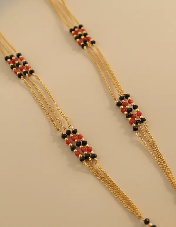 Traditional_Multi-Strand_Gold_and_Black_Bead_Mangalsutra_with_Floral_Pendants
