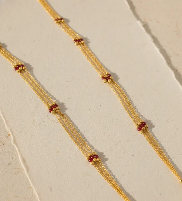 Traditional_Three-Strand_Gold_Mala_with_Intricate_Filigree_Pendant