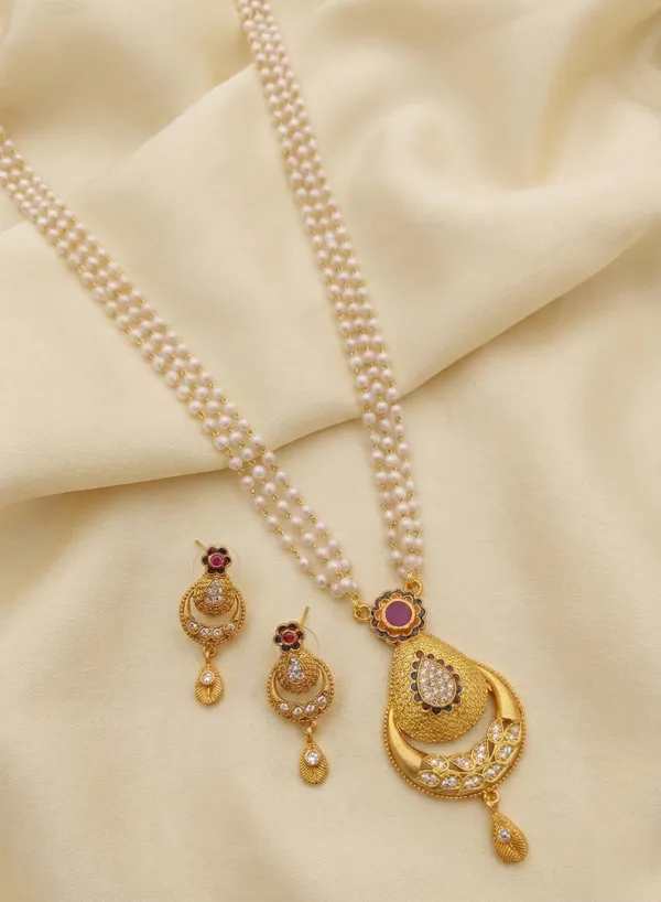 Traditional_Three-Strand_Pearl_Mala_with_Intricate_Gold-Tone_Pendant_and_Matching_Earrings