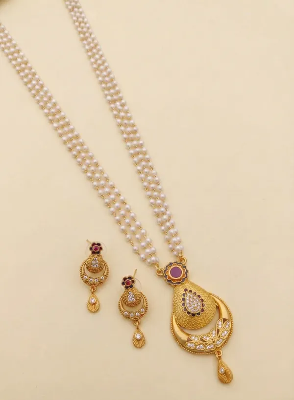 Traditional_Three-Strand_Pearl_Mala_with_Intricate_Gold-Tone_Pendant_and_Matching_Earrings