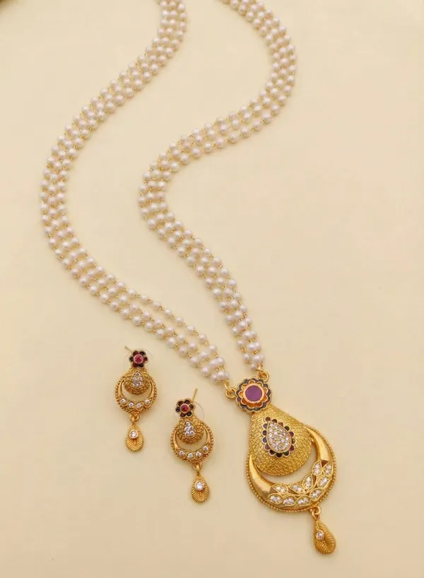 Traditional_Three-Strand_Pearl_Mala_with_Intricate_Gold-Tone_Pendant_and_Matching_Earrings