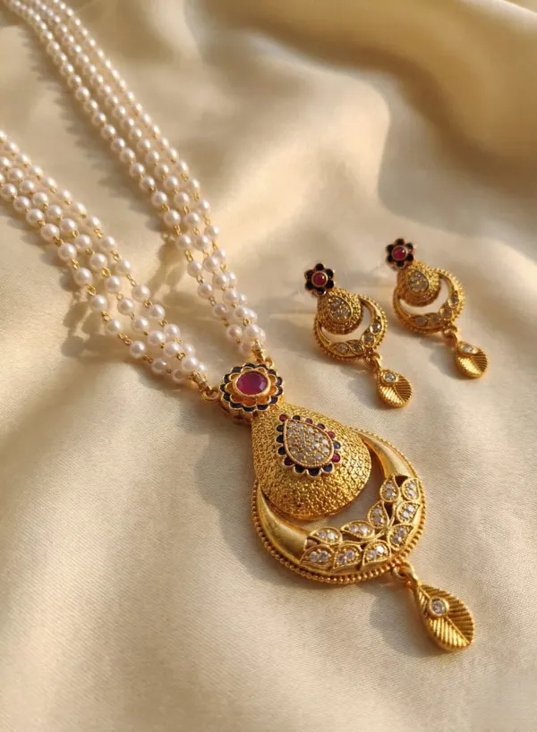 Traditional_Three-Strand_Pearl_Mala_with_Intricate_Gold-Tone_Pendant_and_Matching_Earrings