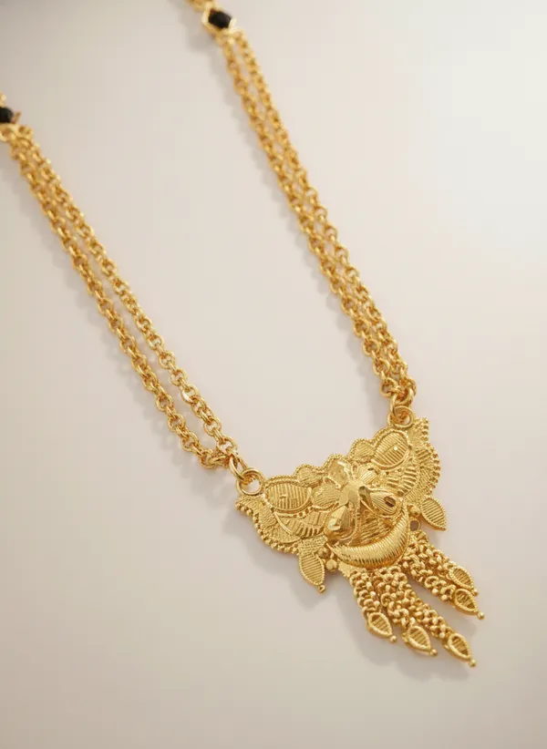 Triple-Strand_Gold_Necklace_with_Ornate_Pendant
