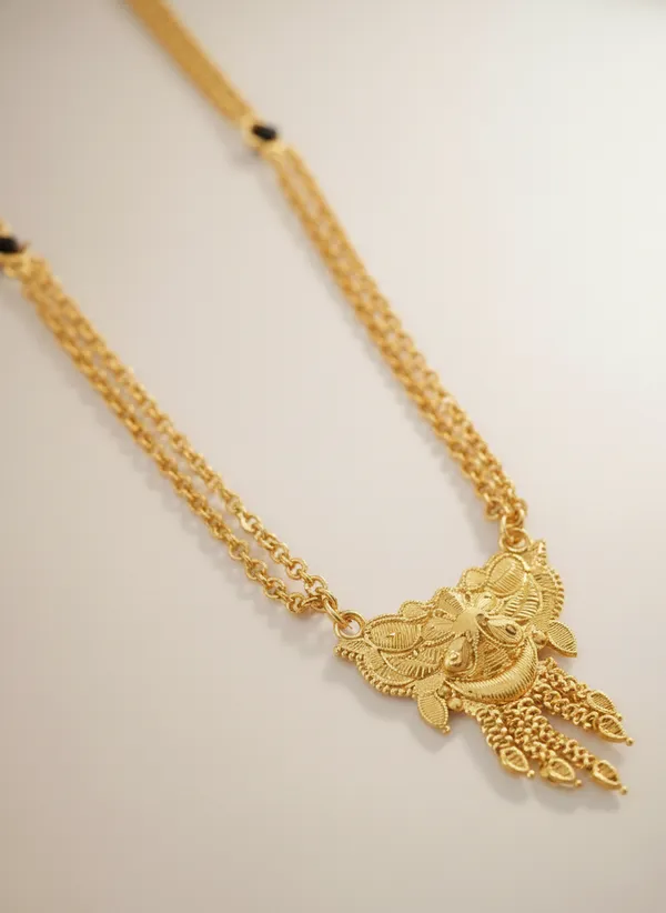 Triple-Strand_Gold_Necklace_with_Ornate_Pendant