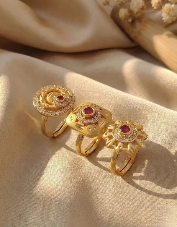 A_Set_of_Three_Ruby-Inlaid_Gold_Statement_Pieces