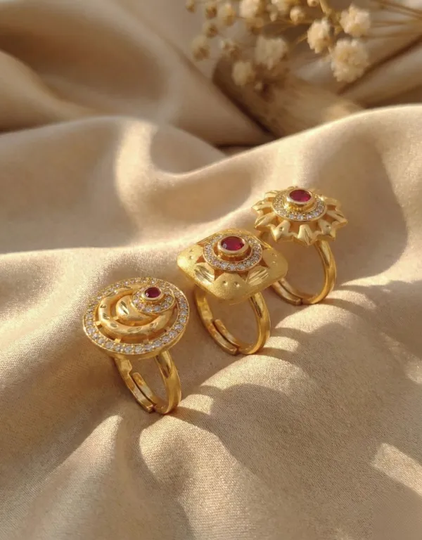 A_Set_of_Three_Ruby-Inlaid_Gold_Statement_Pieces