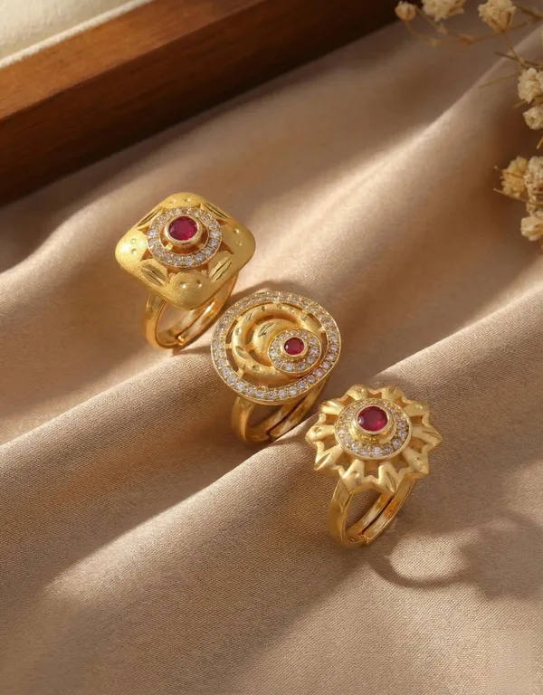 A_Set_of_Three_Ruby-Inlaid_Gold_Statement_Pieces