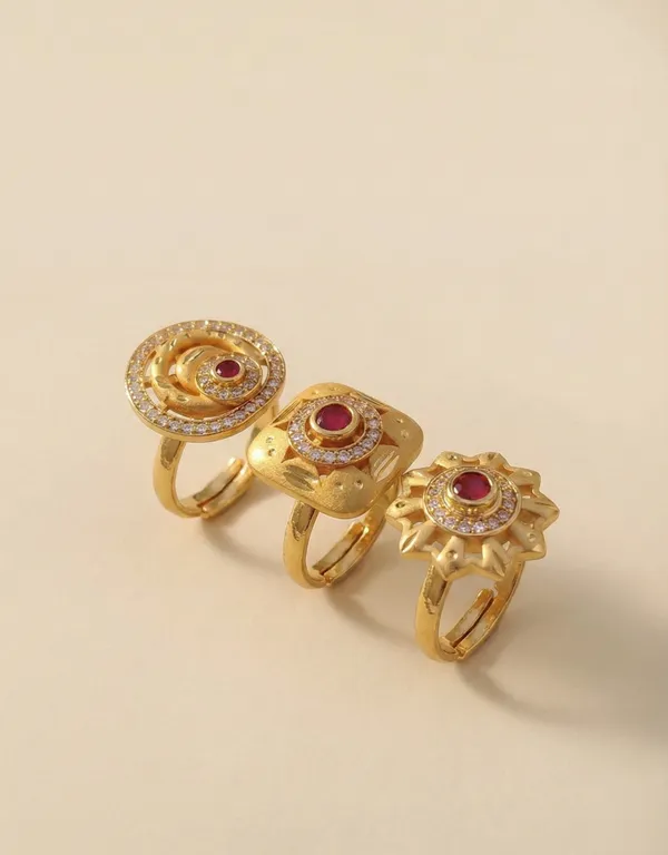 A_Set_of_Three_Ruby-Inlaid_Gold_Statement_Pieces