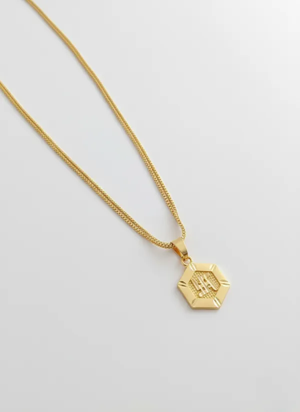 Gold-Toned_Hexagon_Pendant_Necklace_with_SWASTIK_Encraved