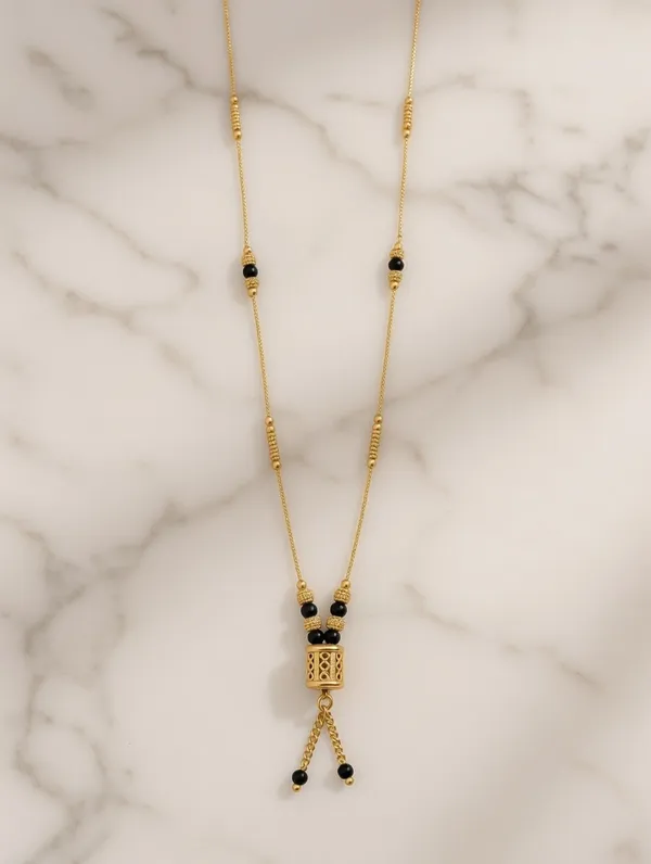 Dainty_Golden_Mangalsutra_with_Cylindrical_Bead_Pendant_and_Tassel_Detail