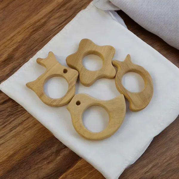 Pack_of_4__Neem_Wooden_Teethers-_Rabbit,_Flower,_Dove_&_Mango_Shapes