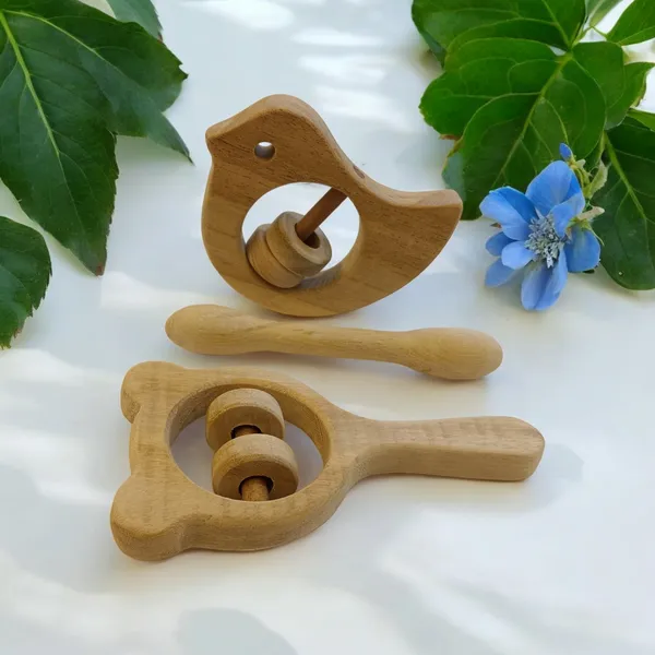 Combo_of_Rattles_&_Teether_-_Dove,_Mickey_Head_&_Dumbbell_Shapes