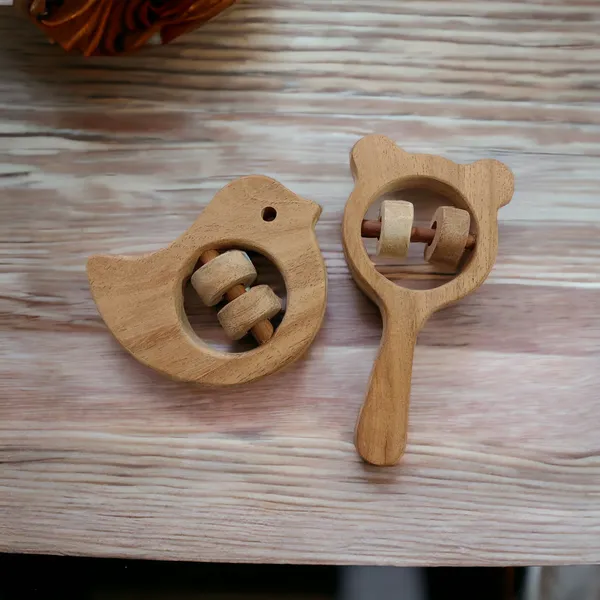 Pack_of_2_Neem_Wooden_Sound_Making_Rattles_of_Shapes_Dove_&_Mikey_Head