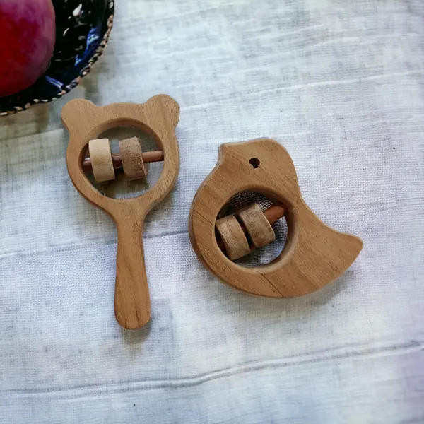 Pack_of_2_Neem_Wooden_Sound_Making_Rattles_of_Shapes_Dove_&_Mikey_Head