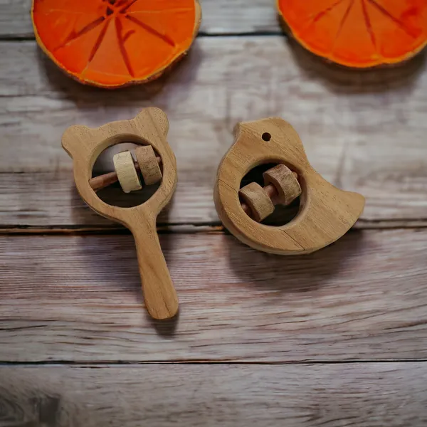 Pack_of_2_Neem_Wooden_Sound_Making_Rattles_of_Shapes_Dove_&_Mikey_Head