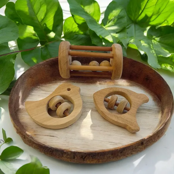 Neem_Wooden_Tumbler,_Dove_&_Rocket_Shaped_Rattle